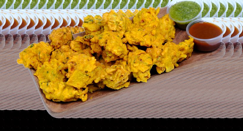 Crispy vegetable pakora with mint and tamarind chutney